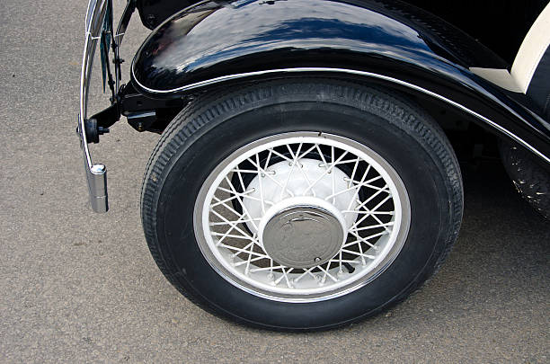 istock Wheel of black antique car 488213672