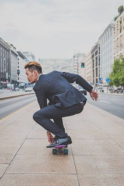 istock Young handsome Asian model riding his skateboard 488215076