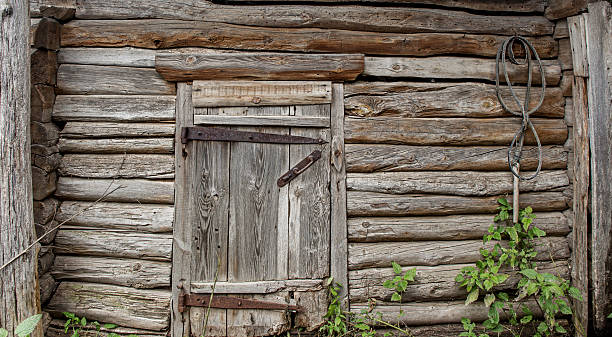 istock wall of logs door. 488215132