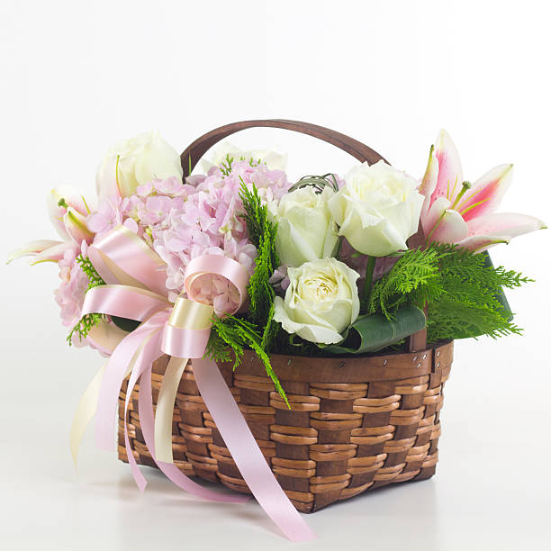 istock Beautiful flowers in basket isolated. 488215318