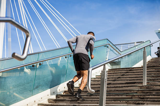 istock Healthy man running up and down on steps 488217054