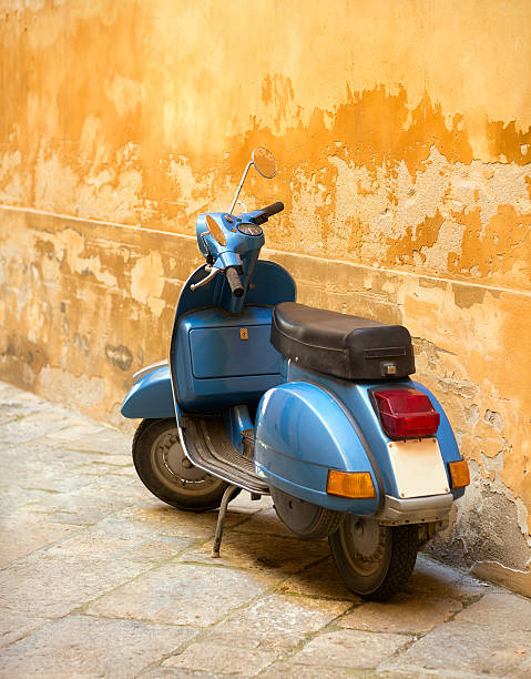 istock Blue scooter and Tuscan wall, Tuscany Italy 488217338