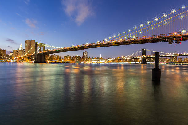 istock Brooklyn bridge and Manhattan bridge at night 488217432