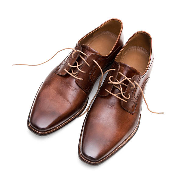istock Mens brown leather shoes isolated 488218044