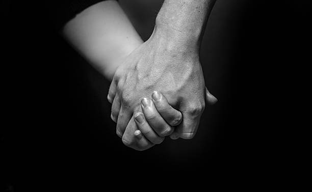istock Man And Woman Holding Hands 488218901