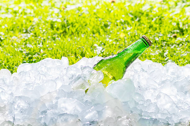 istock beer and ice, out of focus grass with an intense 488219097