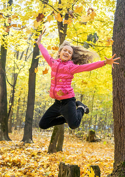 istock Happy young girl in high jump 488219194