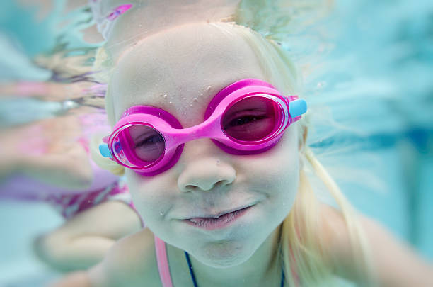istock Little girls playing underwater 488219216