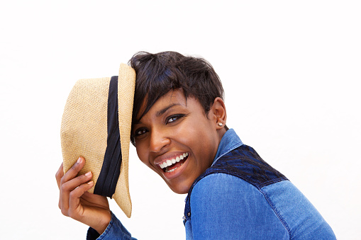 Close up portrait of an african american fashion model smiling with hat