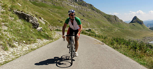 istock Cyclist pedaling in the mountains 488220218