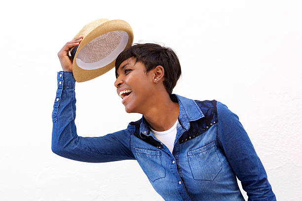 istock Smiling african american woman holding hat 488220326