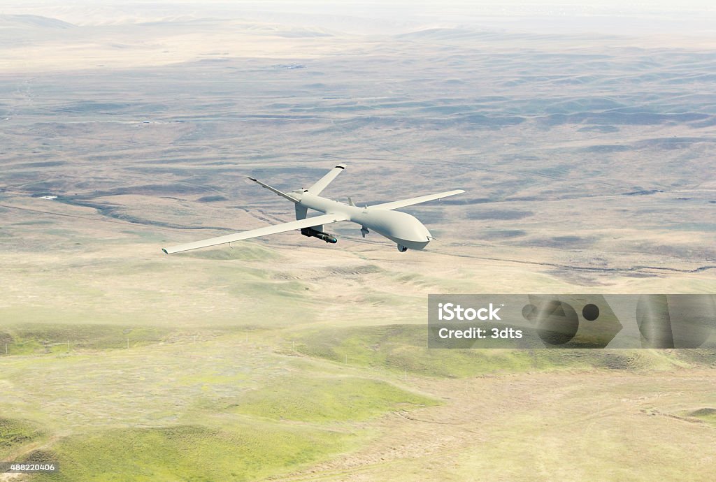 War drone flying over the desert A war drone (Unmanned aerial vehicle - UAV) flying over the desert. Original 3d model. Drone Stock Photo