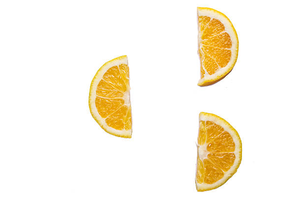 istock slices of orange on a white background 488221201