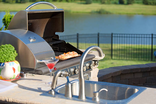 istock Cooking Cedar Salmon on the Barbecue at the Outdoor Kitchen 488221463