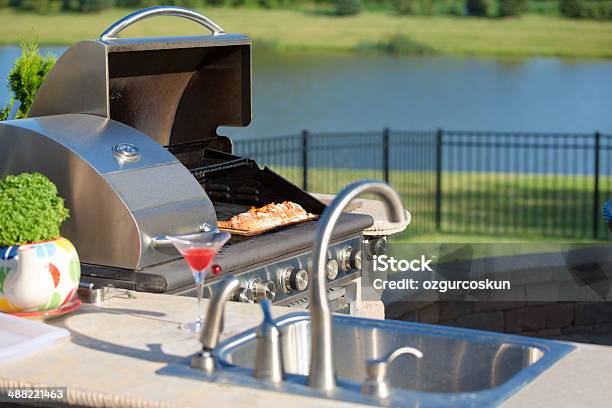 Cooking Cedar Salmon On The Barbecue At The Outdoor Kitchen Stock Photo - Download Image Now
