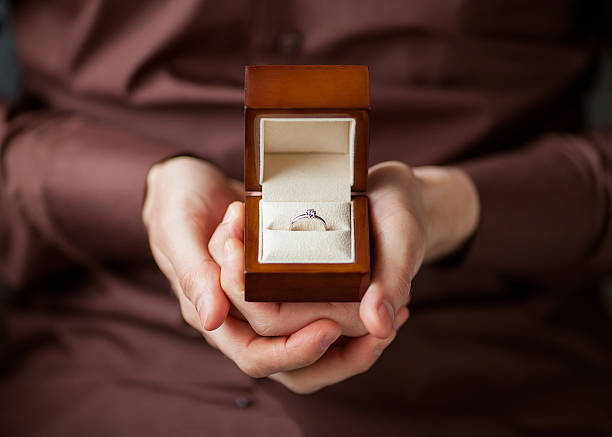istock Man giving an engagement  box with ring 488221701