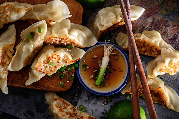 istock Pan Fried Asian Pot Stickers with soy sauce 488222252