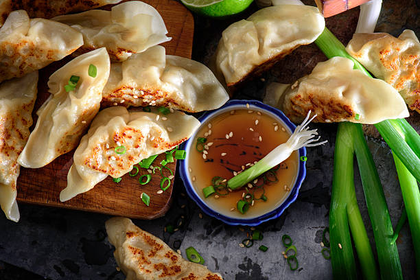 Pan Fried Pot Stickers with soy sauce Pot Stickers with soy sauce chinese dumpling photos stock pictures, royalty-free photos & images