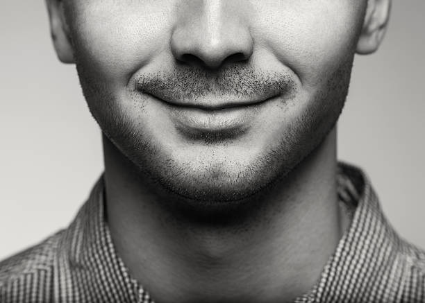 istock Charming and handsome man half face close up 488222769