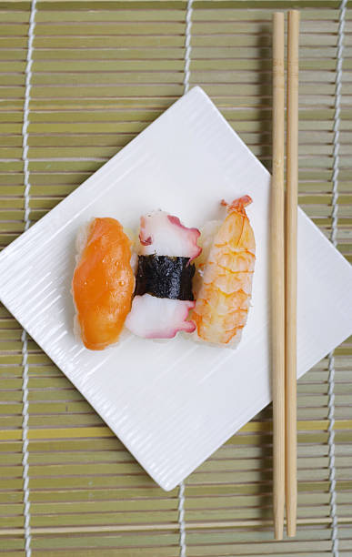 istock Sushi nigiri in dish with bamboo sticks 488240285