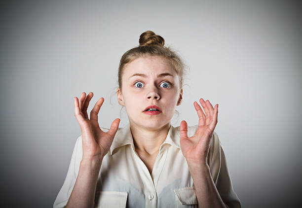 Education, teenage adolescence concept. Angry teenager student girl with ponytails having brown hair.