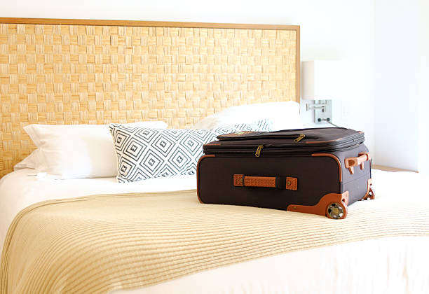 istock suitcase on the bed inside a hotel room 488241202