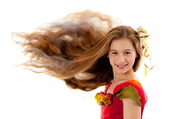 Fresh faced young woman with long brown hair smiling