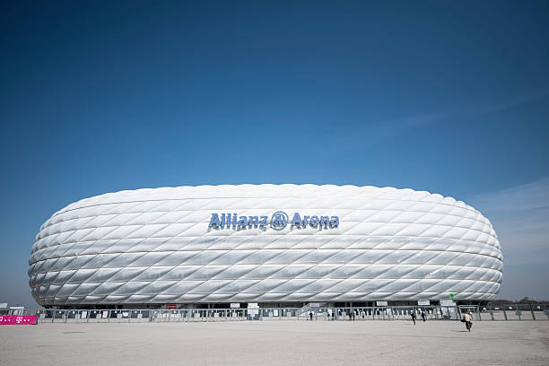 Allianz Arena Munich Munich, Germany - March 28, 2014: Detail of the Allianz Arena , It was constructed for the homesoccer team of the club FC Bayern München. Some visitors in front of the stadium can be seen. allianz arena stock pictures, royalty-free photos & images