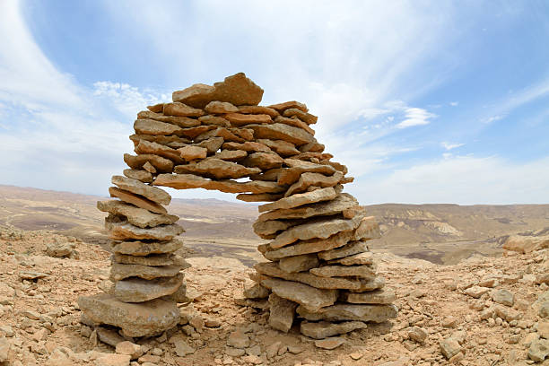 Stone cairn on mount trail in the middle of Negev desert, Israel