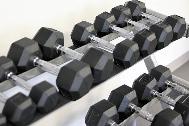 istock many dumbbells are at stand at the gym 488242894