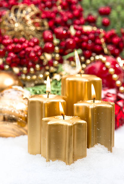 istock advent decoration in gold and red with four burning candles 488243103