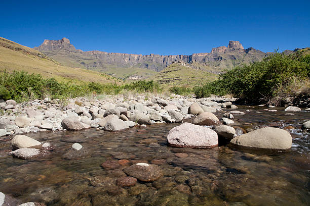 The Tugela River flows beneath the Drakensburg Ampitheatre on a stunning summers day