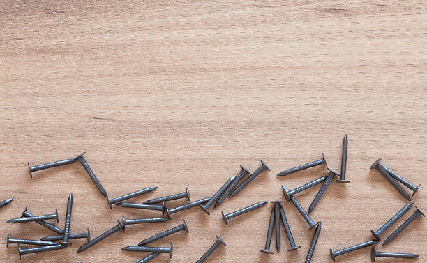 istock Nails laying on wood 488243850