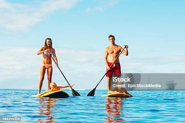 Family Fun Stand Up Paddling Stock Photo - Download Image Now - Family, Paddleboarding, Oar