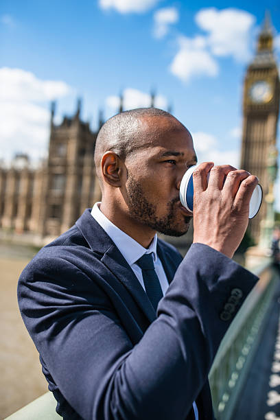 istock Businessman with coffee mug chilling in London 488245536