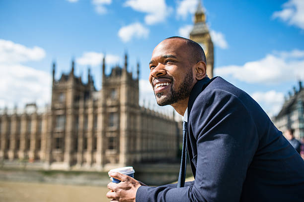 Businessman with coffee mug chilling in London
