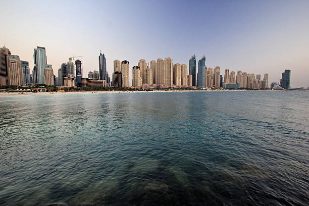 Promenade in luxury Dubai Marina with modern skyscrapers in Dubai,United Arab Emirates. City scape of Jumeirah. View on Dubai skyline at the sunrise. January-29,2024