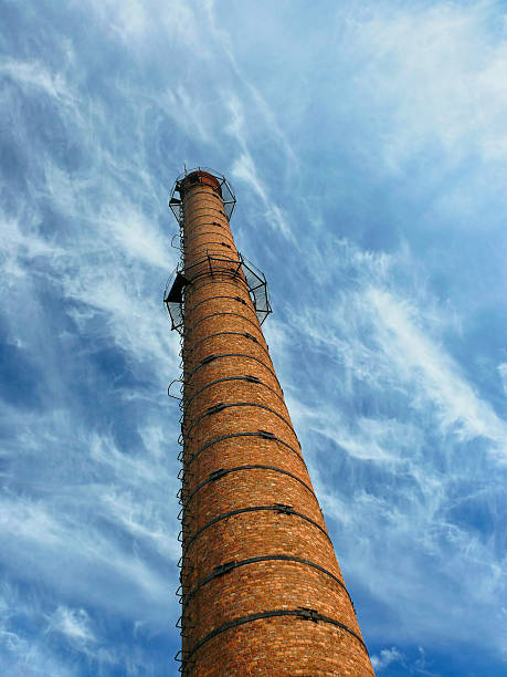 istock Industrial Old Brick Chimney  on blue sky 488246582