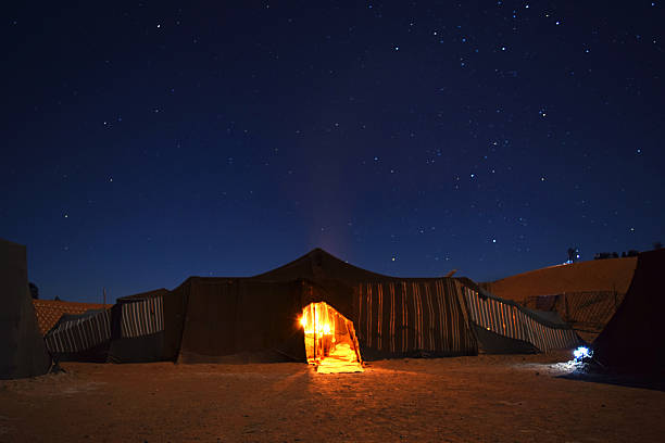 istock Starry sky and a tent in a camp in Sahara Desert 488249918