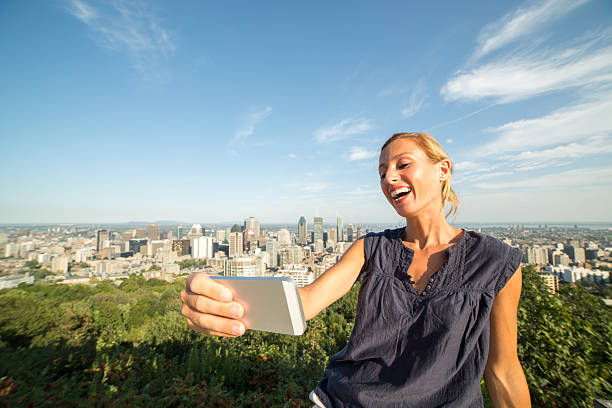 istock Student in Montreal taking selfie portrait with mobile phone 488251918