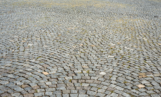 Closeup Cobblestone pavement, background with copy space, full frame horizontal composition