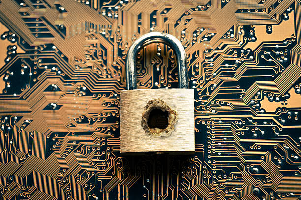 computer system security breach A penetrated security lock with a hole on computer circuit board background penetration stock pictures, royalty-free photos & images