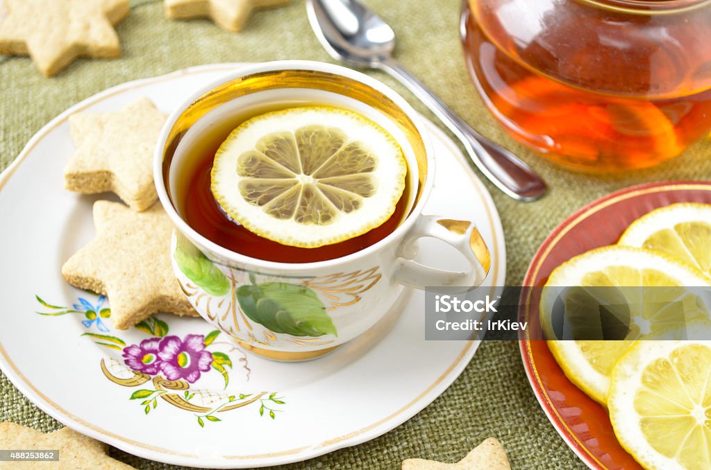 Homemade star cookies with tea and lemon Homemade star cookies with tea and lemon. 2015 Stock Photo