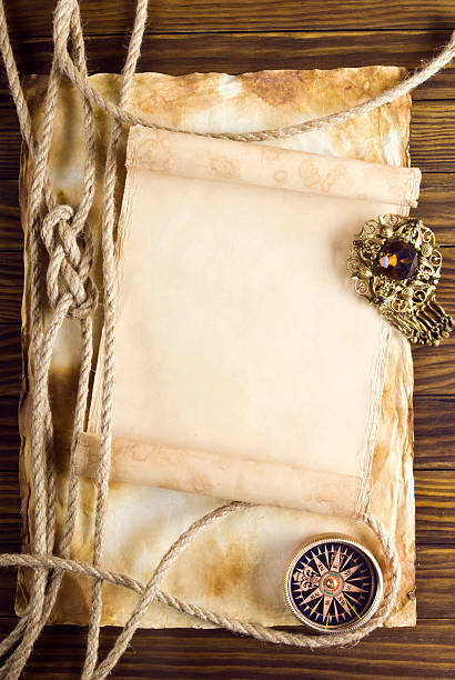 istock Rope and compass on the old paper background 488258751