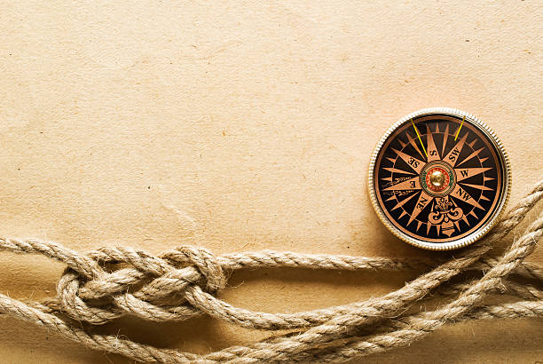 liny i kompas na stary papier tle - morska busola zdjęcia i obrazy z banku zdjęć
