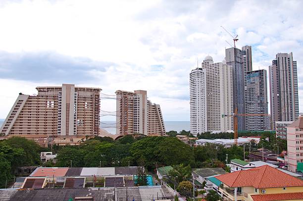 istock View of tall building on cloudy sky background 488259561