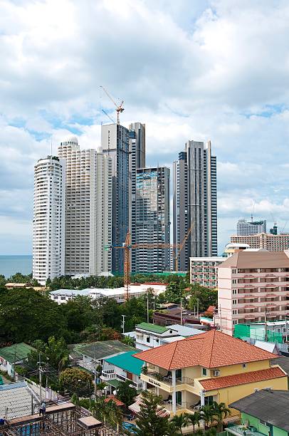 istock Tall building under construction and city around 488259567