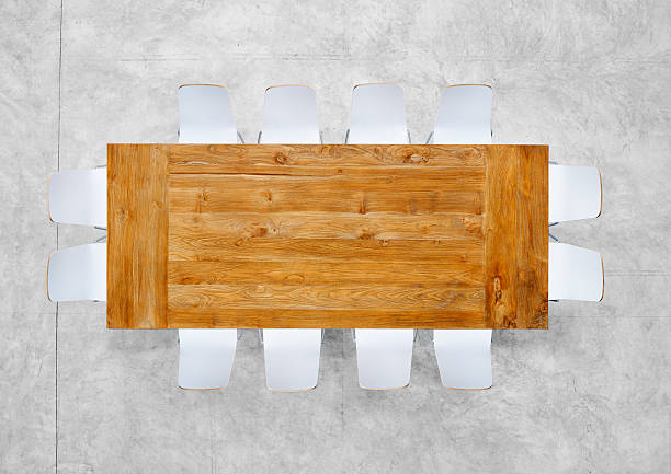 istock Large Brown Meeting Table with Twelve Chairs 488259927