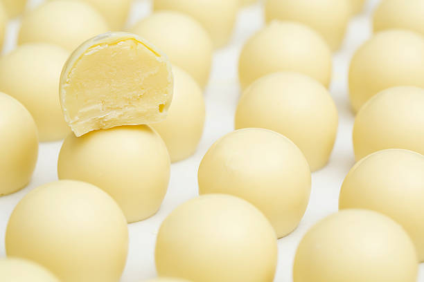 Rows of white chocolate truffles at the factory Rows of white chocolate truffles at the chocolate factory. You might also be interested in these: chocolate truffle stock pictures, royalty-free photos & images