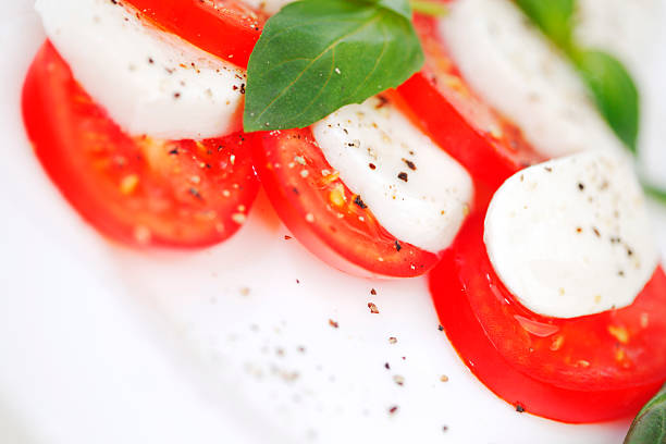 istock Tomato and mozzarella slices on a plate 488260933